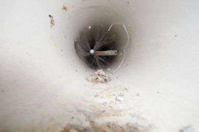 Dirty circular vent with brush inside